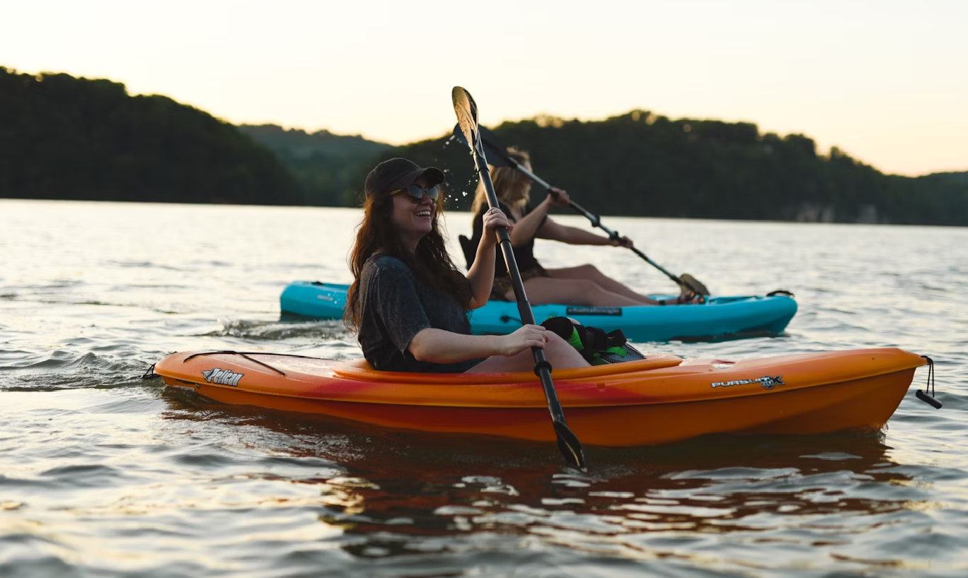 two girls kayaking in the sea