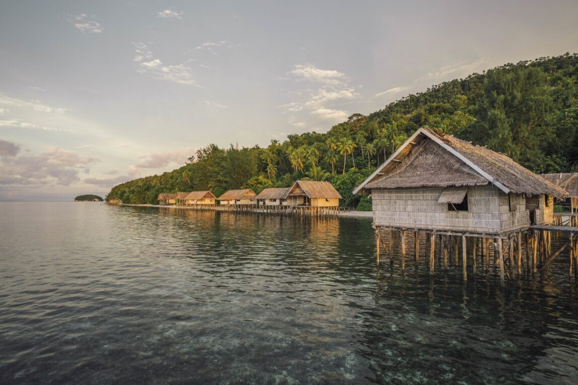 Kri Eco Resort papuan cottage when sunset by Papua Diving Resorts team located in Raja Ampat, Indonesia